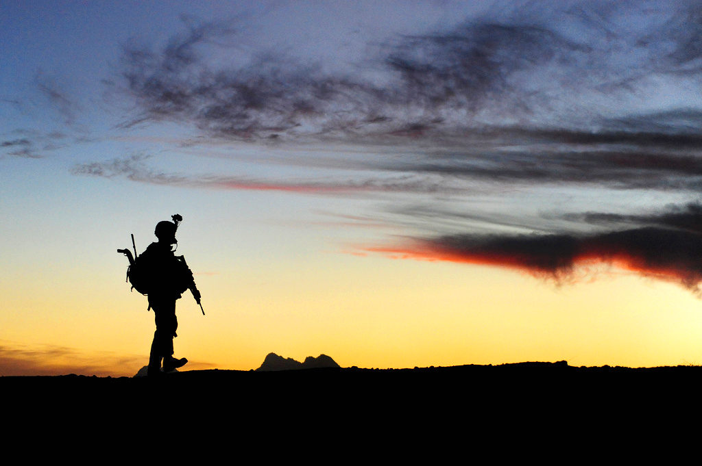 A U.S. Soldier with Charlie Company, 1st Battalion, 17th Infantry Regiment walks to a joint district community center after securing combat outpost Rajankala in the Kandahar province of Afghanistan Nov. 26, 2009. (DoD photo by Tech. Sgt. Francisco V. Govea II, U.S. Air Force/Released)