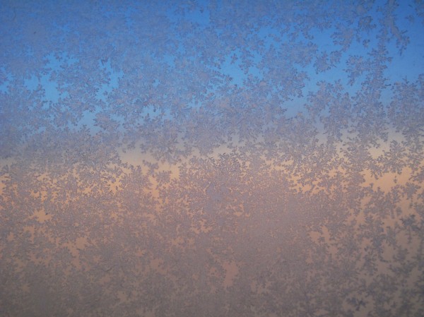 Frost on airplane window (Photo by Wikimedia user Downtowngal)