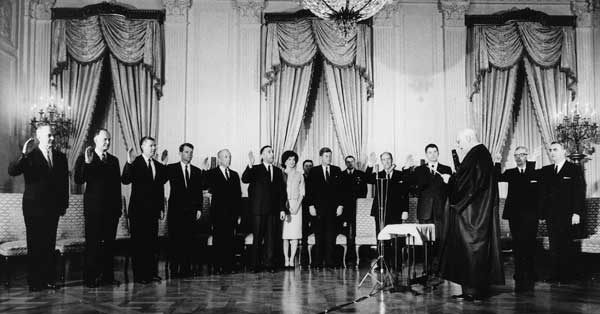 Justice Earl Warren swearing in the Kennedy cabinet at the White House in January 1961 (National Archives)