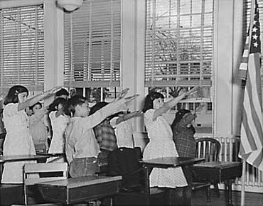 Students pledging allegiance to the American flag with the Bellamy salute