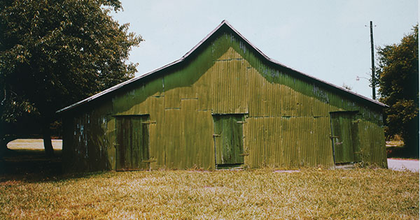 Green Warehouse, Newbern, Alabama, 1978 by William Christenberry; gift of Mr. and Mrs. William Christenberry (Phillips Collection)