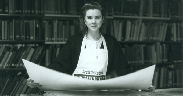 A Sweet Briar College student, Aylish O'Connor, looking at architectural drawings, 1990. (Mary Helen Cochran Library)