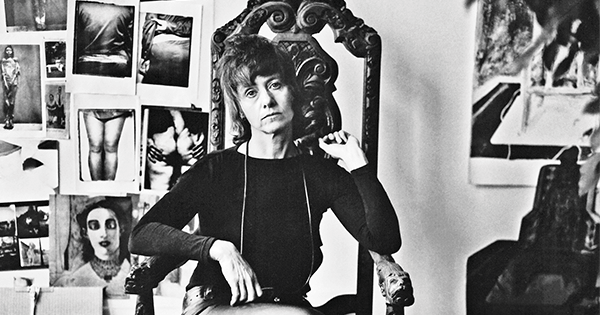 Arbus in her New York City apartment in 1971. On the wall behind her are photographs of victims of violence and people with physical deformities. (Eva Rubinstein)