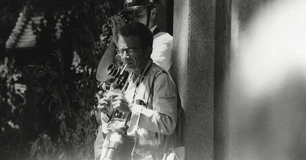 Ted Streshinsky on assignment in 1965, covering protests as a train passes through Berkeley with troops heading for Vietnam.