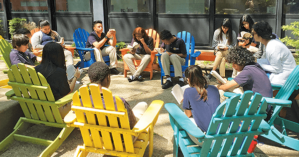 At the Noble Academy in Chicago, students take the Harkness system outside. Since the method has been in use, test scores have dramatically improved. (Lauren Boros)