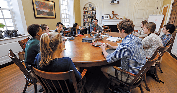 Phillips Exeter Academy students sit at an oval table to enhance a teaching method that depends on every student listening as well as talking. (Cheryl Senter/Phillips Exeter Academy)
