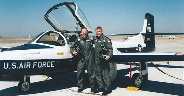The author (left) and a pilot school classmate stand beside a Cessna T-37 “Tweet” trainer at Vance Air Force Base in Enid, Oklahoma. (Courtesy Brandon Lingle)