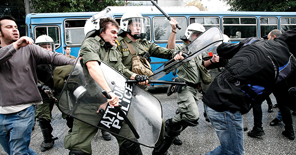 Anti-austerity protests in October 2012 disrupted a Greek military parade marking the country's entry into World War II. (Konstantinos Tsakalidis/ Alamy Stock Photo)