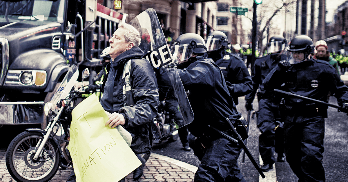 A scene from the protests at Donald Trump's Inauguration, where over 230 people—including journalists and legal observers—were surrounded by police and arrested en masse. Two journalists still face felony charges and over 70 years in prison. (Johnny Silvercloud/Flickr)