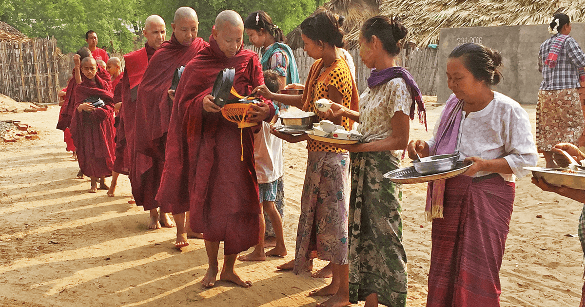 In June 2013, Myint led a procession of novitiates, including the author, in the collection of alms in the remote farming village of Padaukone. (Courtesy of the author)