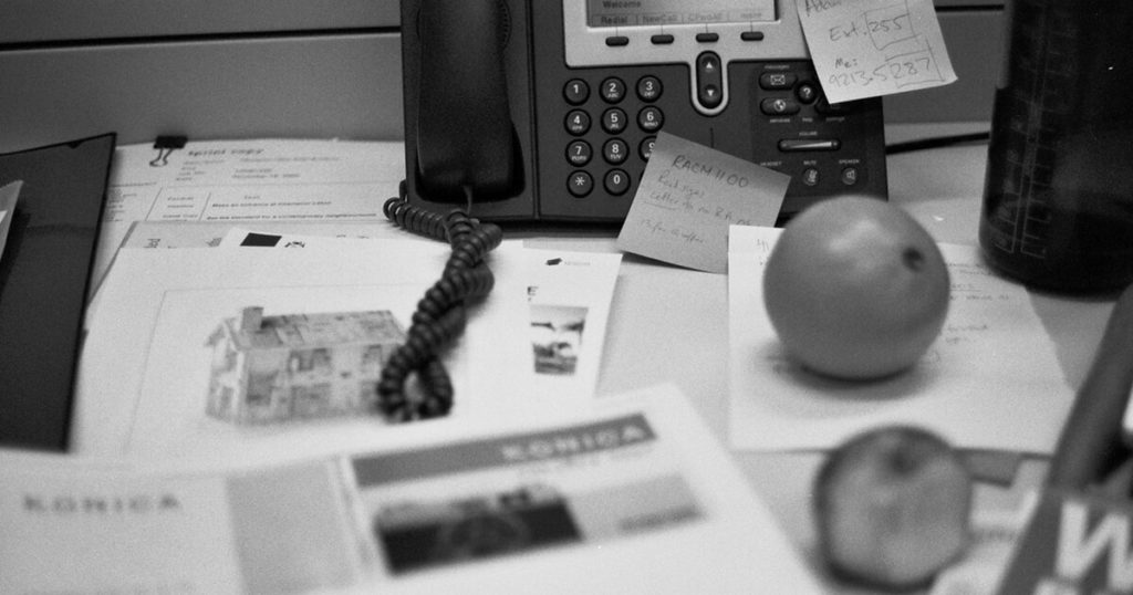 Black and white photo of an office desk