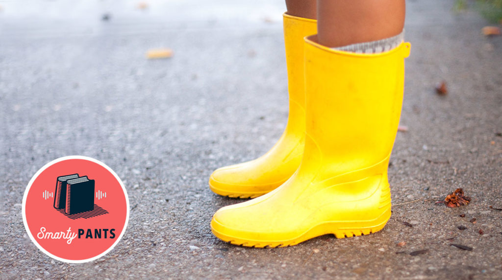 a pair of yellow rainboots on pavement
