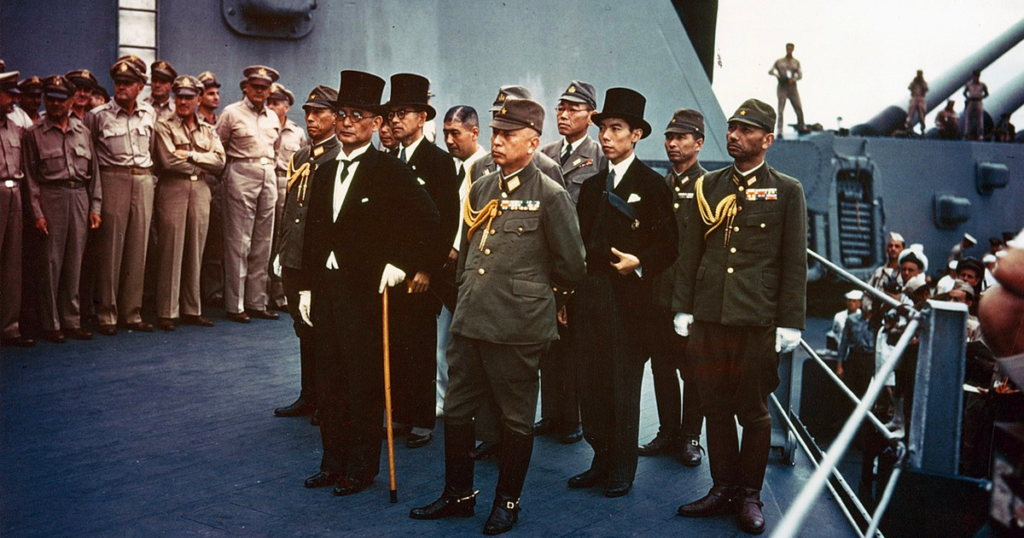 The surrender of Imperial Japan was announced by Japanese Emperor Hirohito on August 15, 1945. Here, representatives of the Empire of Japan stand aboard USS <em>Missouri</em> prior to signing of the Instrument of Surrender on September 2, 1945.
