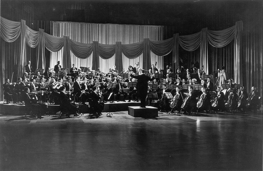 Sir Ernest MacMillan conducting the Toronto Symphony Orchestra for a Canadian Broadcasting Corporation production, ca. 1947 (Wikimedia Commons)