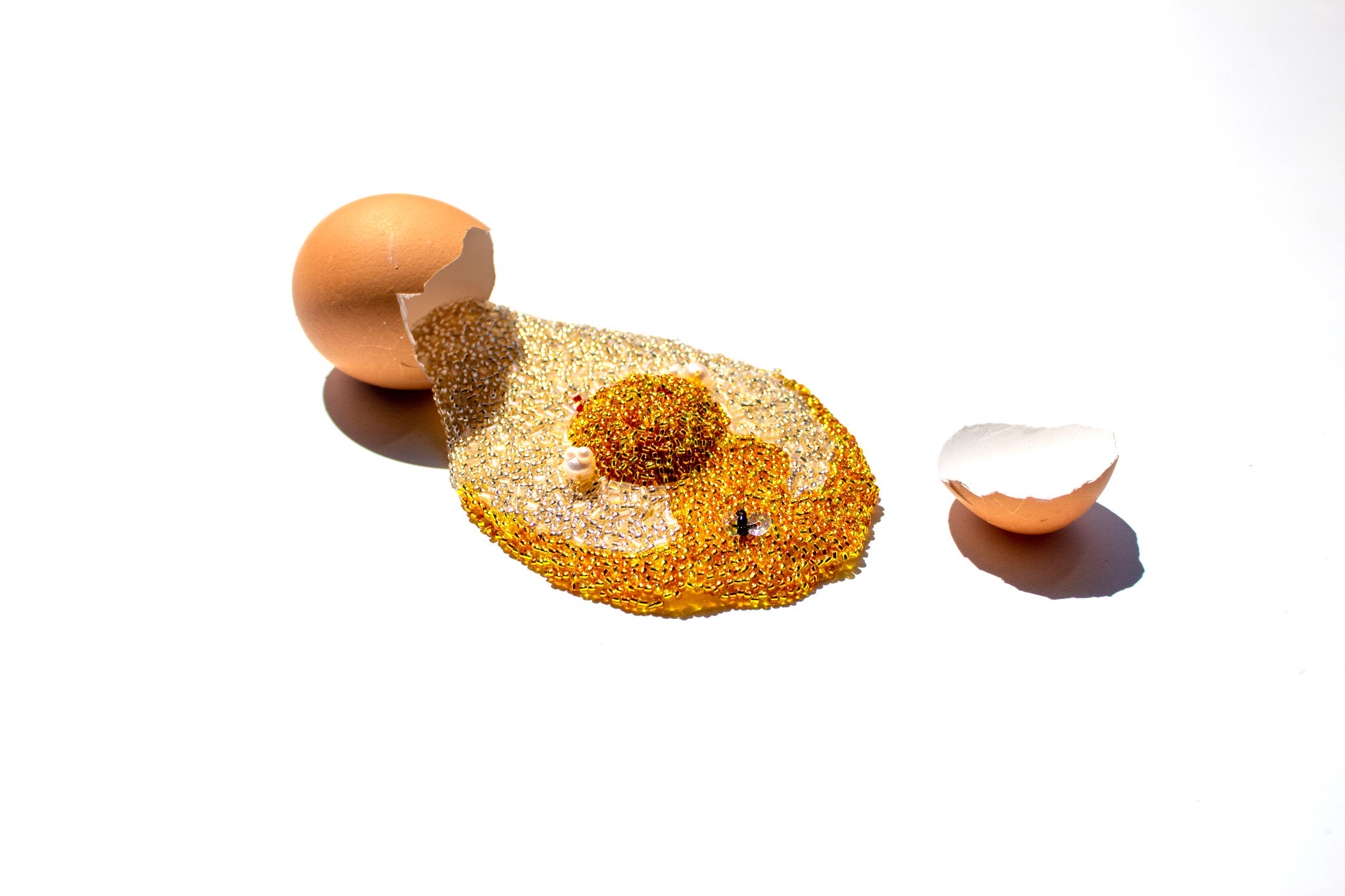 Broken Yolk, 2022, hand embroidered soft sculpture. (Images courtesy of Carly Owens Weiss.)