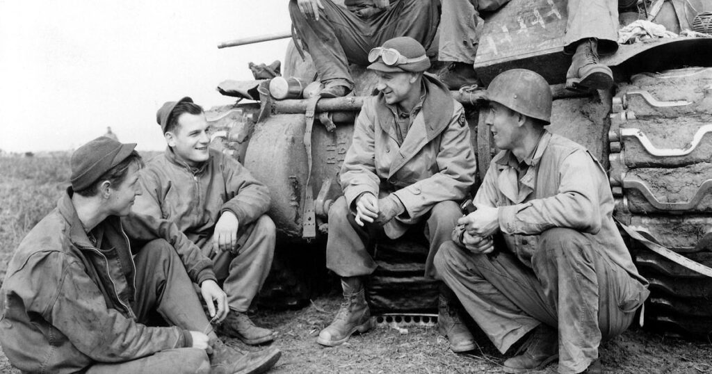 Ernie Pyle, second from right, with members of the 191st Tank Battalion in Anzio, Italy, 1944 (U.S. Army Center of Military History/Wikimedia Commons)