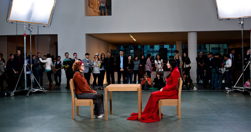 Marina Abramović performs <em>The Artist is Present</em> at the Museum of Modern Art in New York, 2010 (Matt Harvey/Flickr)