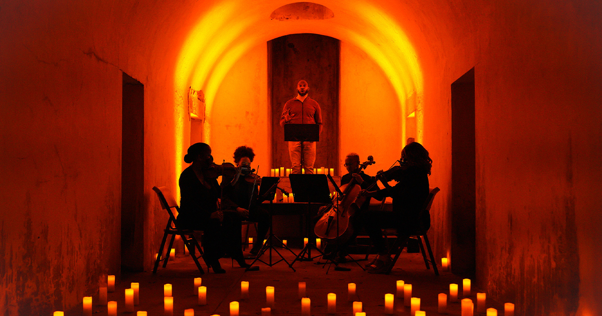 Tenor Ivan Thompson performs with a string quartet in the Green-Wood Cemetery Catacombs as part of a concert presented by Death of Classical, 2020. (Steven Pisano/Flickr)
