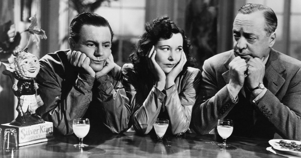 From left: Naunton Wayne, Peggy Bryan, and Basil Radford in <em>Dead of Night</em>, 1945
